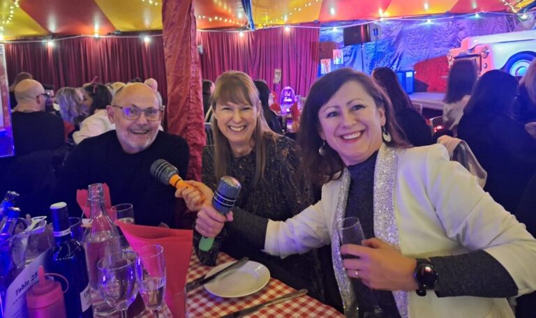 Suzanne Deacon, Quality Assurance Manager at Jarvis, seated at a table between two Jarvis colleagues.